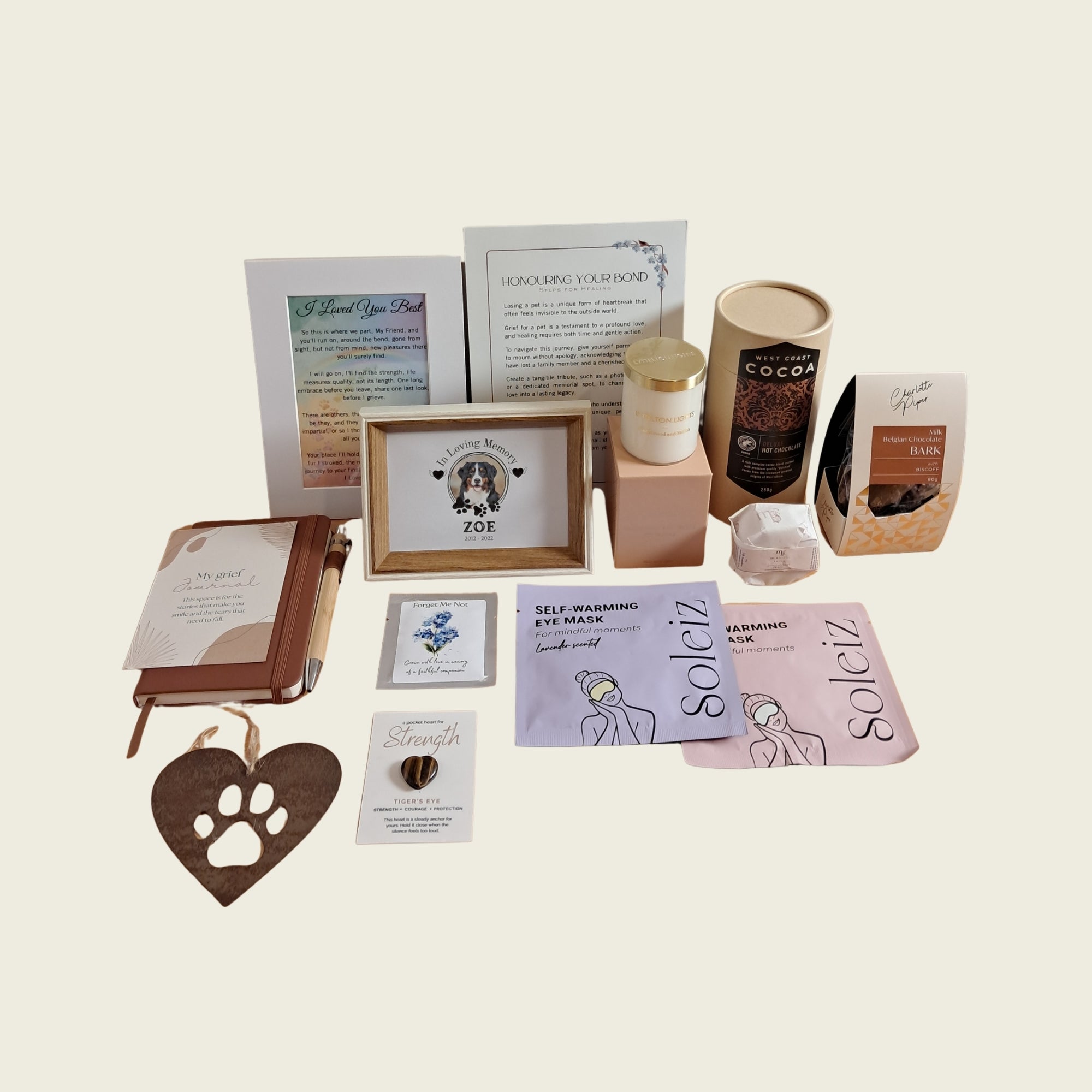 Rainbow Bridge Comfort luxury pet bereavement gift box featuring a personalized dog memorial frame, grief journal, candle, care items, and gourmet treats.
