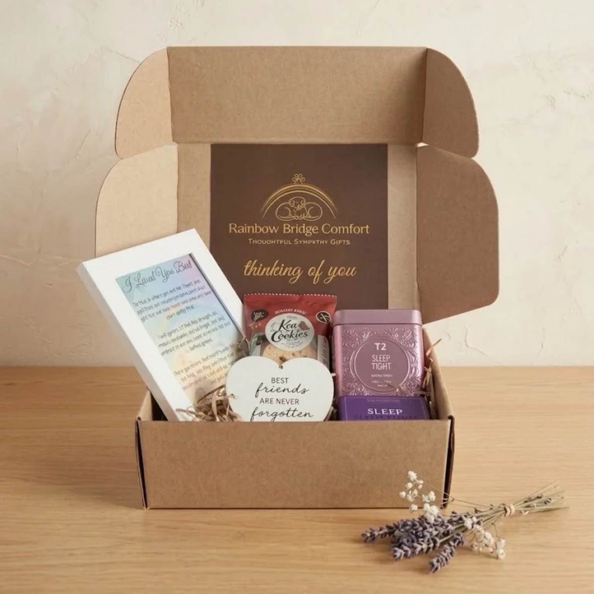 Pet bereavement care box containing a frame, cookie, ornament, tea, and shower steamer fro Rainbow Bridge Comfort.
