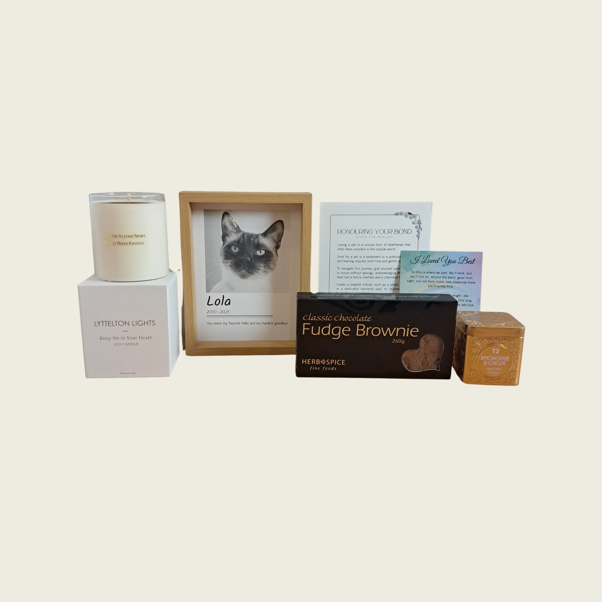 Remembrance Deluxe pet memorial gift including custom framed photo portrait, Lyttelton Lights remembrance candle, chocolate fudge brownie, gourmet tea tin, comforting poem, and sympathy card.