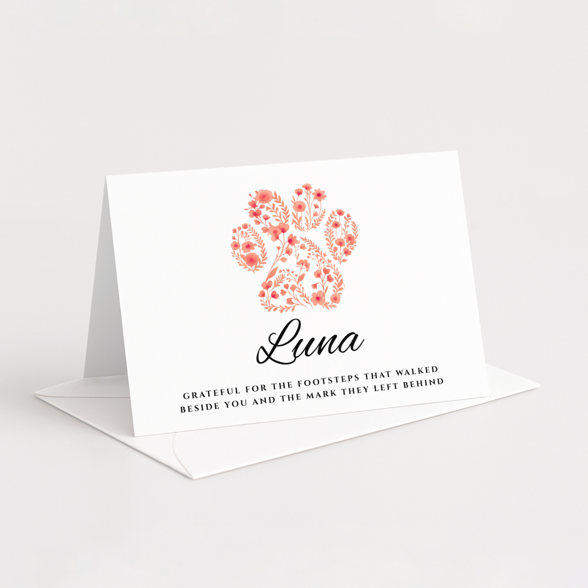 Personalised pet sympathy card with floral paw print and custom pet name.