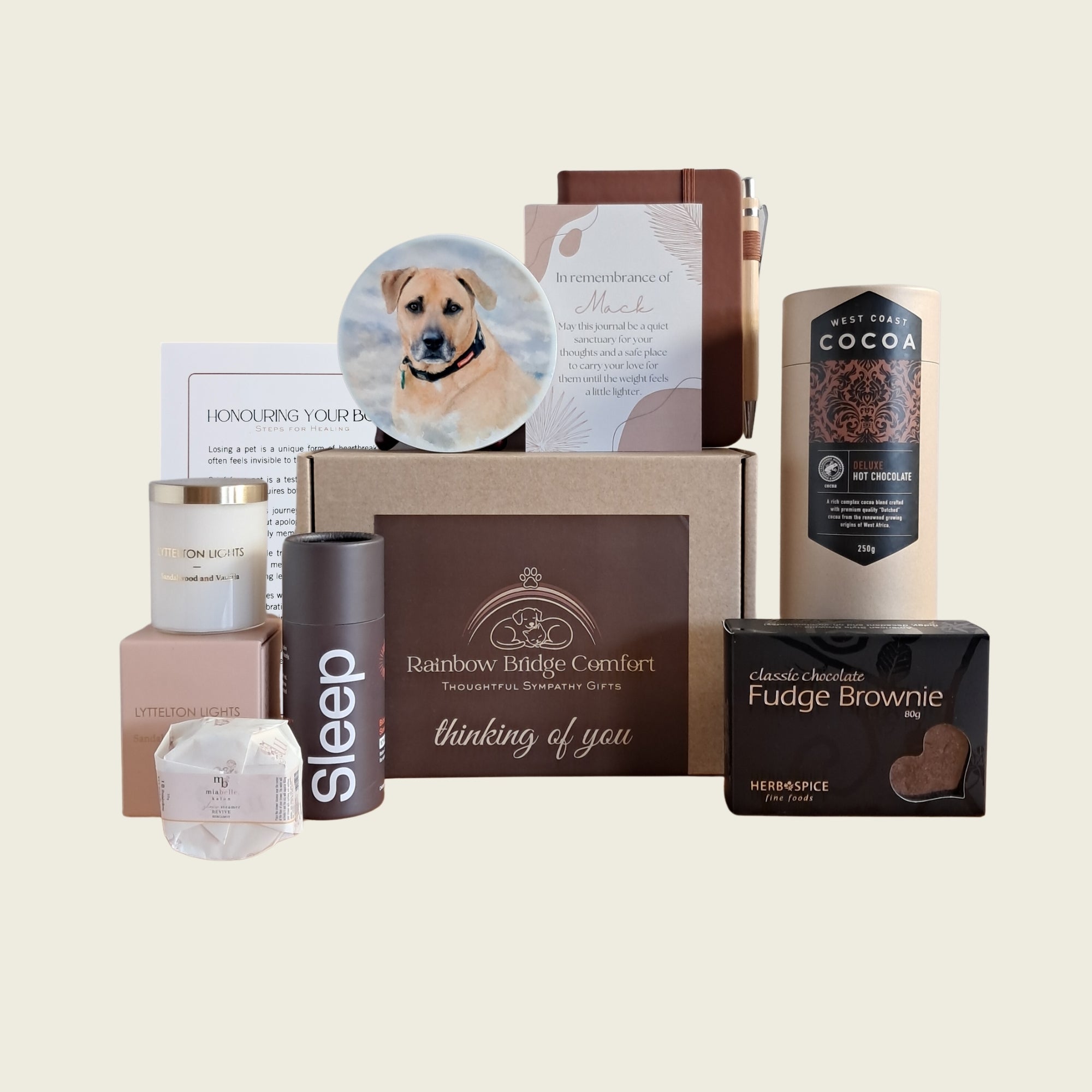 Rainbow Bridge Comfort pet sympathy gift box with personalised coaster, remembrance journal, hot chocolate, fudge brownie, candle, and comfort items.