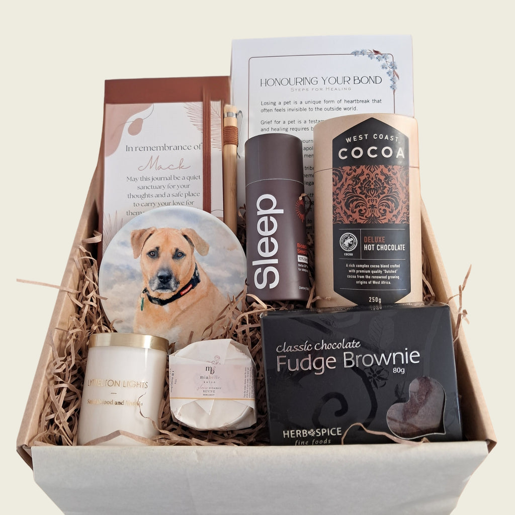 Pet sympathy gift box with personalised coaster, remembrance journal, hot chocolate, brownie, and candle. 