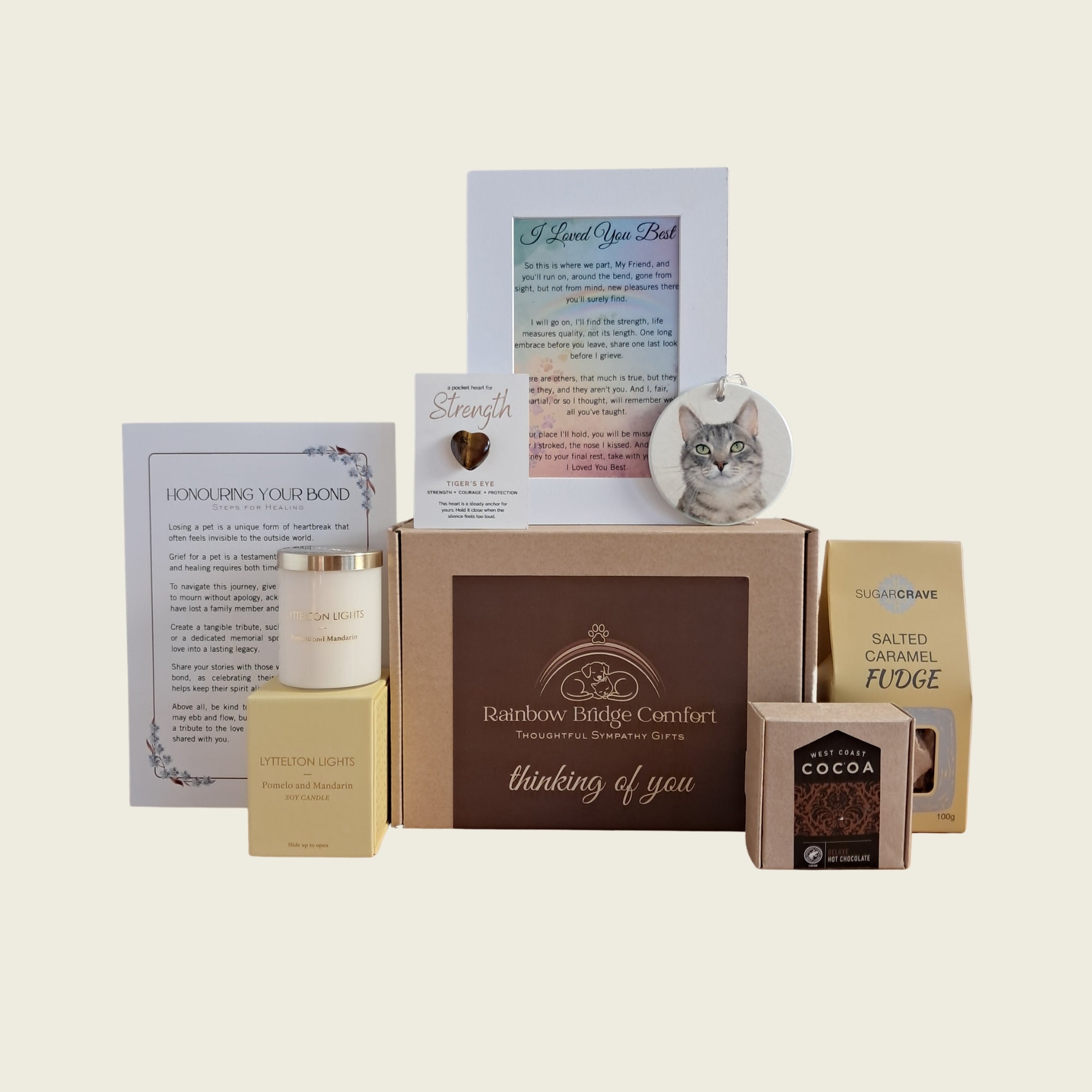 The Remembrance Mini pet memorial gift box includes personalised ceramic ornament, candle, premium sweet treats, tiger's eye heart.