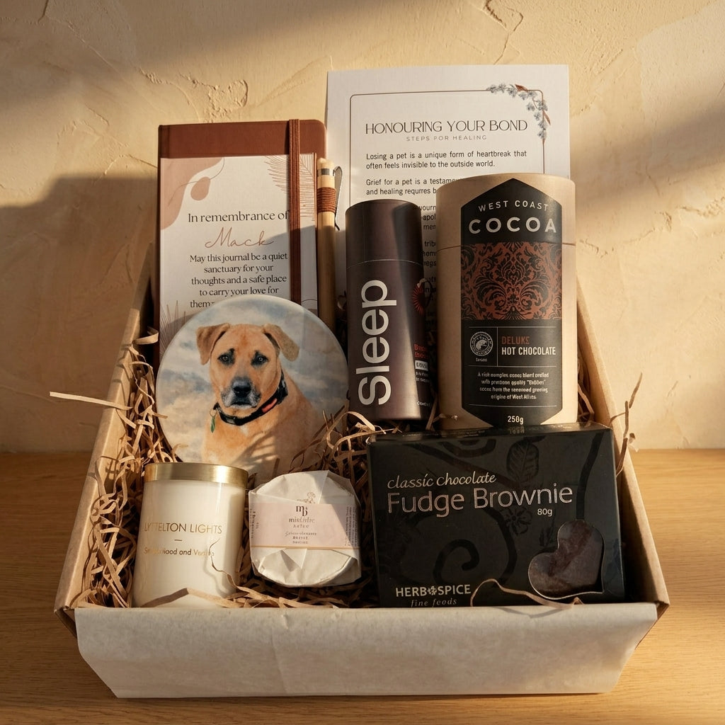 Rainbow Bridge Comfort pet bereavement gift box with personalised coaster, remembrance journal, hot chocolate, fudge brownie, candle, and comfort items.