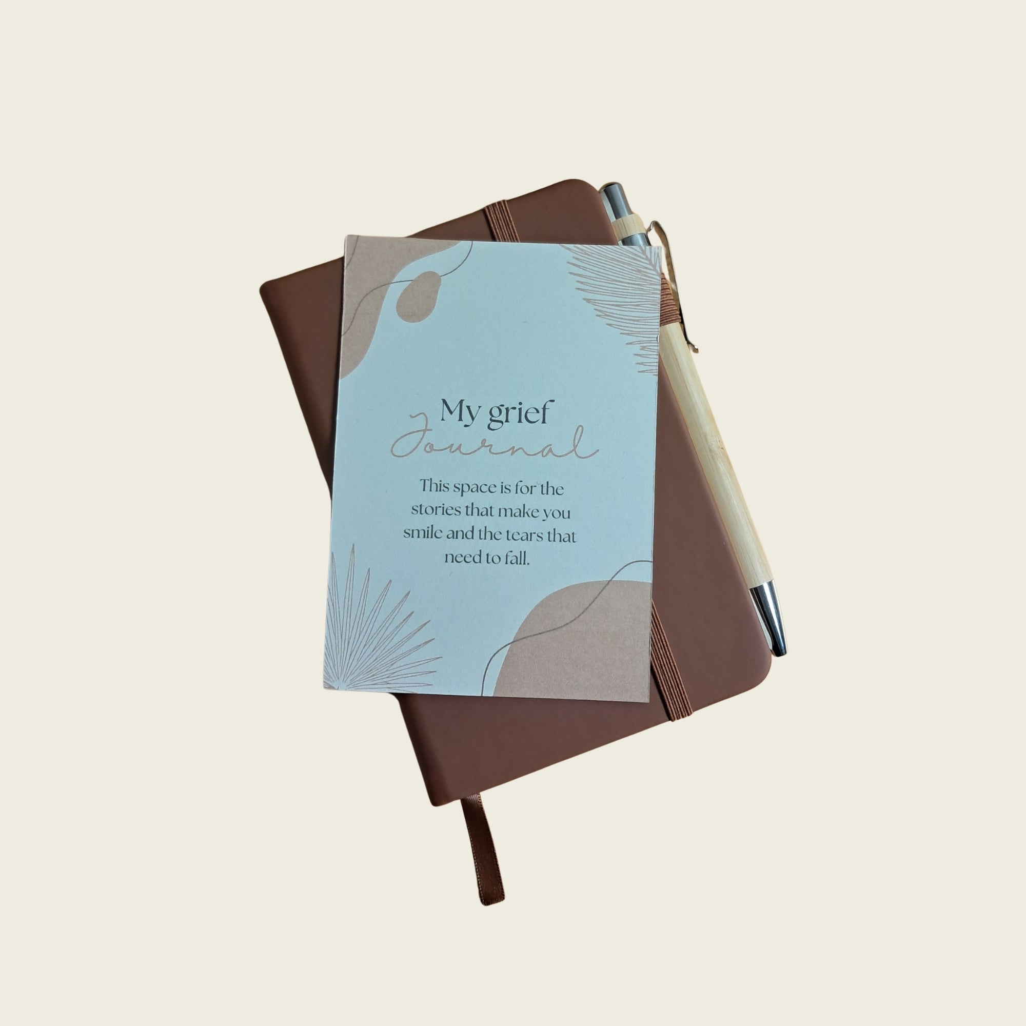Brown A6 grief journal with pen